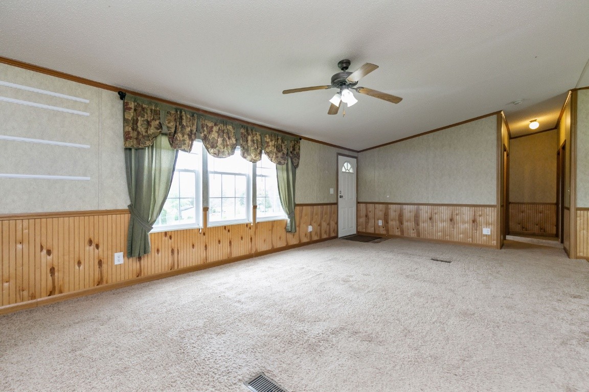 399 Calvert Ridge Road Westmoreland, TN 37186 - Photo 5 of 31 an empty room with windows and fan
