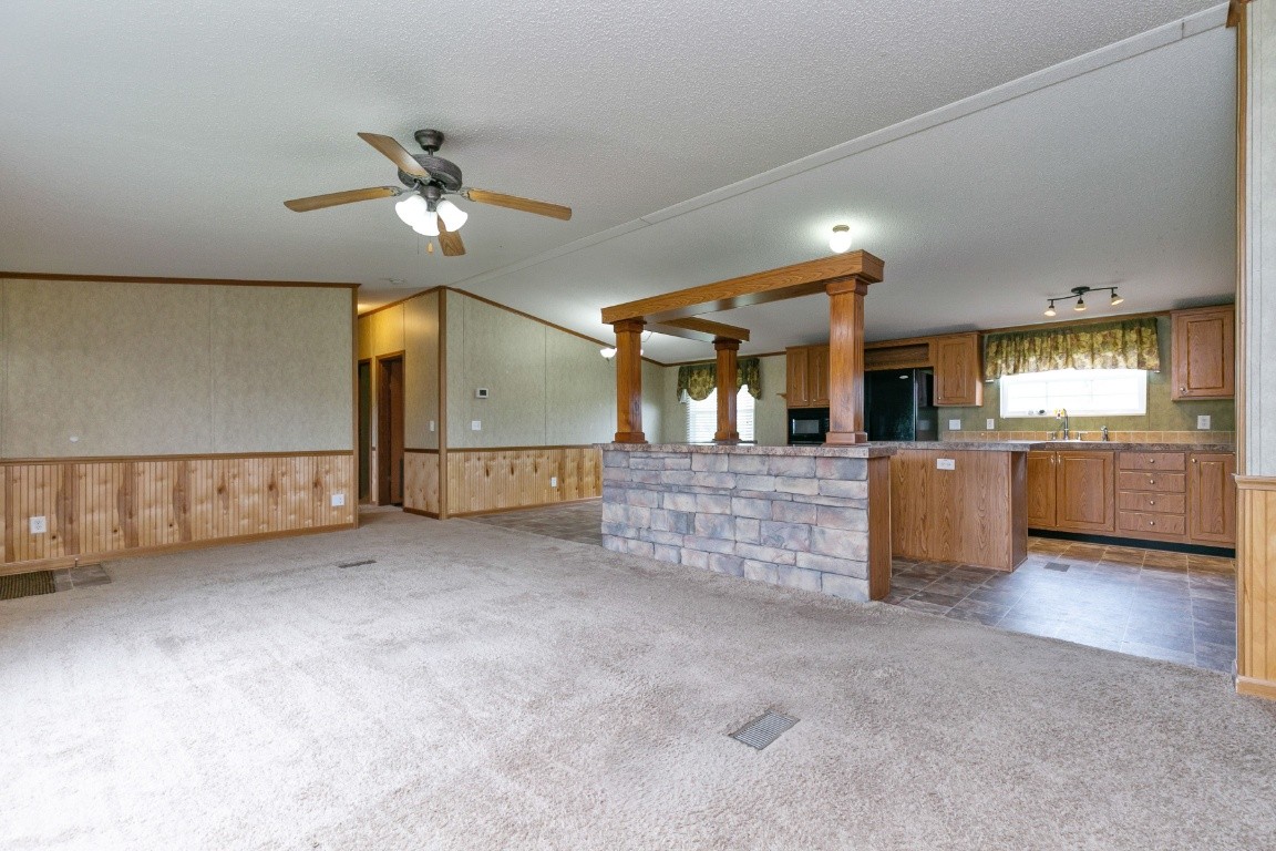399 Calvert Ridge Road Westmoreland, TN 37186 - Photo 6 of 31 a view of an empty room with a kitchen
