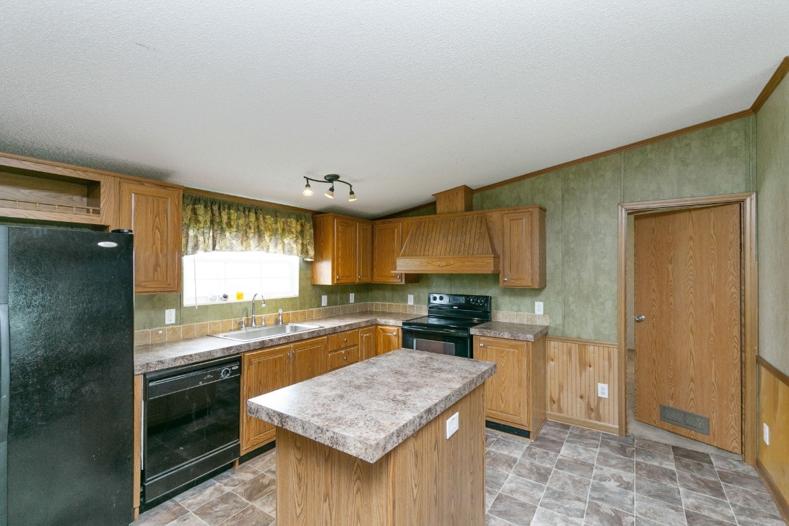 399 Calvert Ridge Road Westmoreland, TN 37186 - Photo 8 of 31 a kitchen with stainless steel appliances granite countertop a sink stove and refrigerator