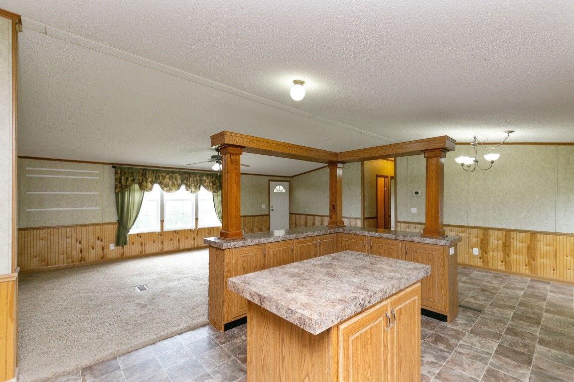 399 Calvert Ridge Road Westmoreland, TN 37186 - Photo 9 of 31 a bathroom with a granite countertop sink and a mirror