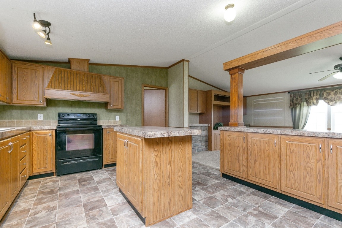 399 Calvert Ridge Road Westmoreland, TN 37186 - Photo 10 of 31 a kitchen with granite countertop a stove and a sink