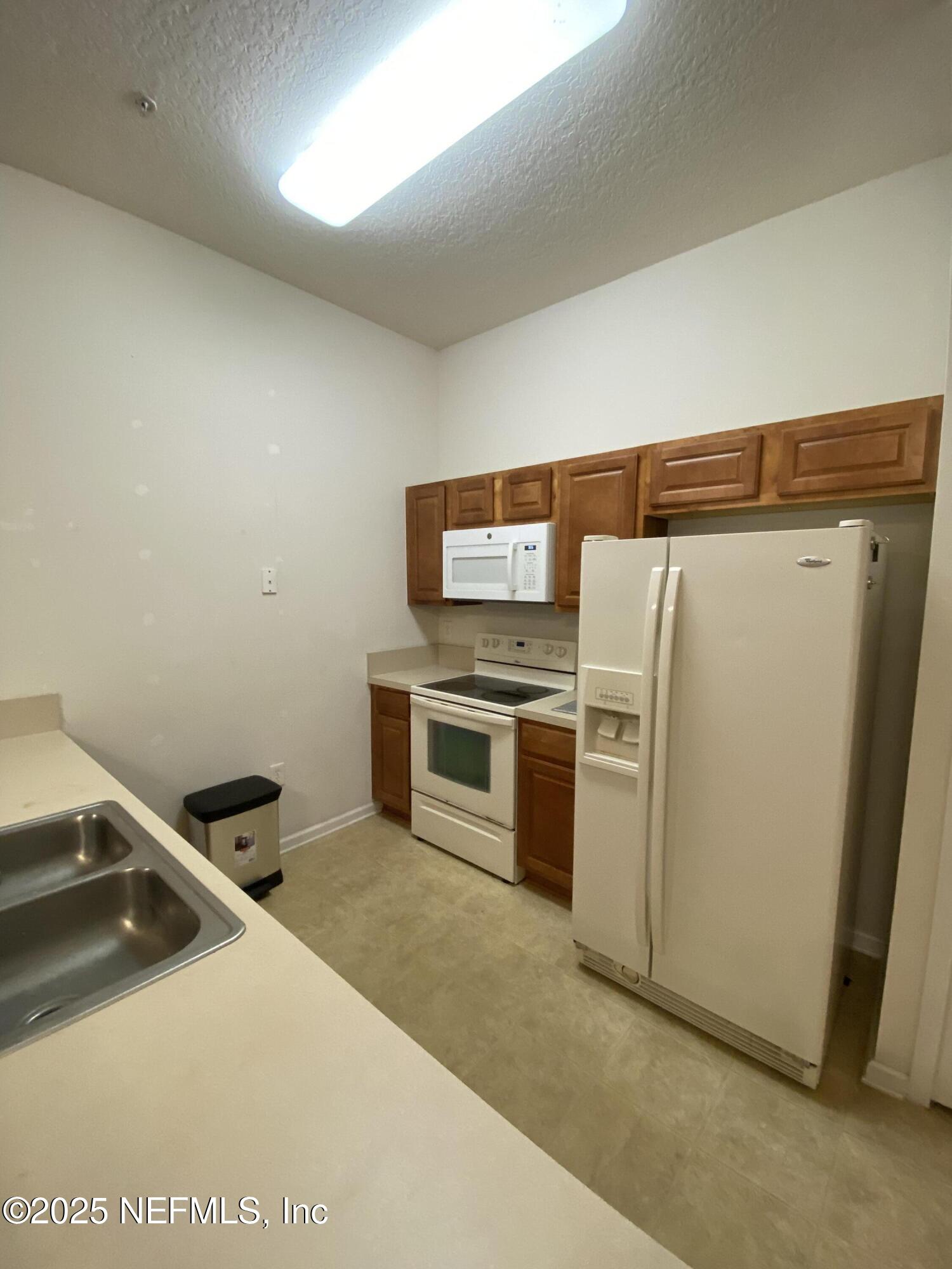 7920 Merrill Road, Unit 405 Jacksonville, FL 32277 - Photo 6 of 12 IMG_5130