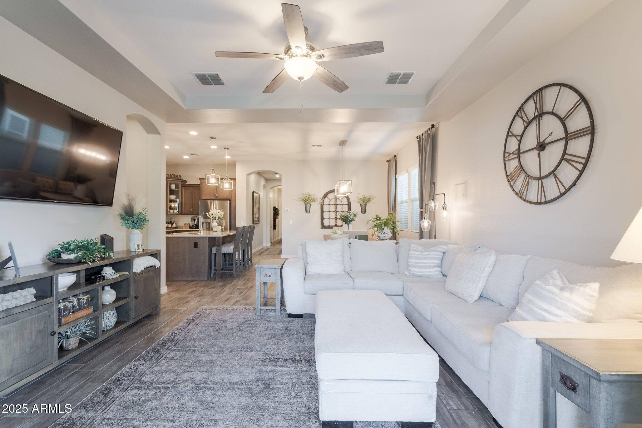 3437 East Appaloosa Road Gilbert, AZ 85296 - Photo 11 of 47 a living room with furniture and a flat screen tv