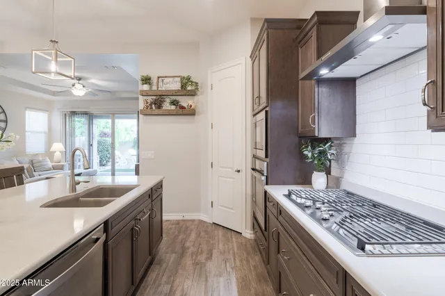 a kitchen with a sink stove and refrigerator