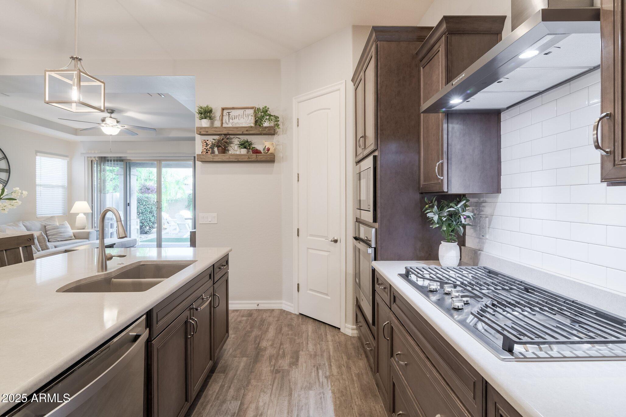 3437 East Appaloosa Road Gilbert, AZ 85296 - Photo 14 of 47 a kitchen with a sink stove and refrigerator