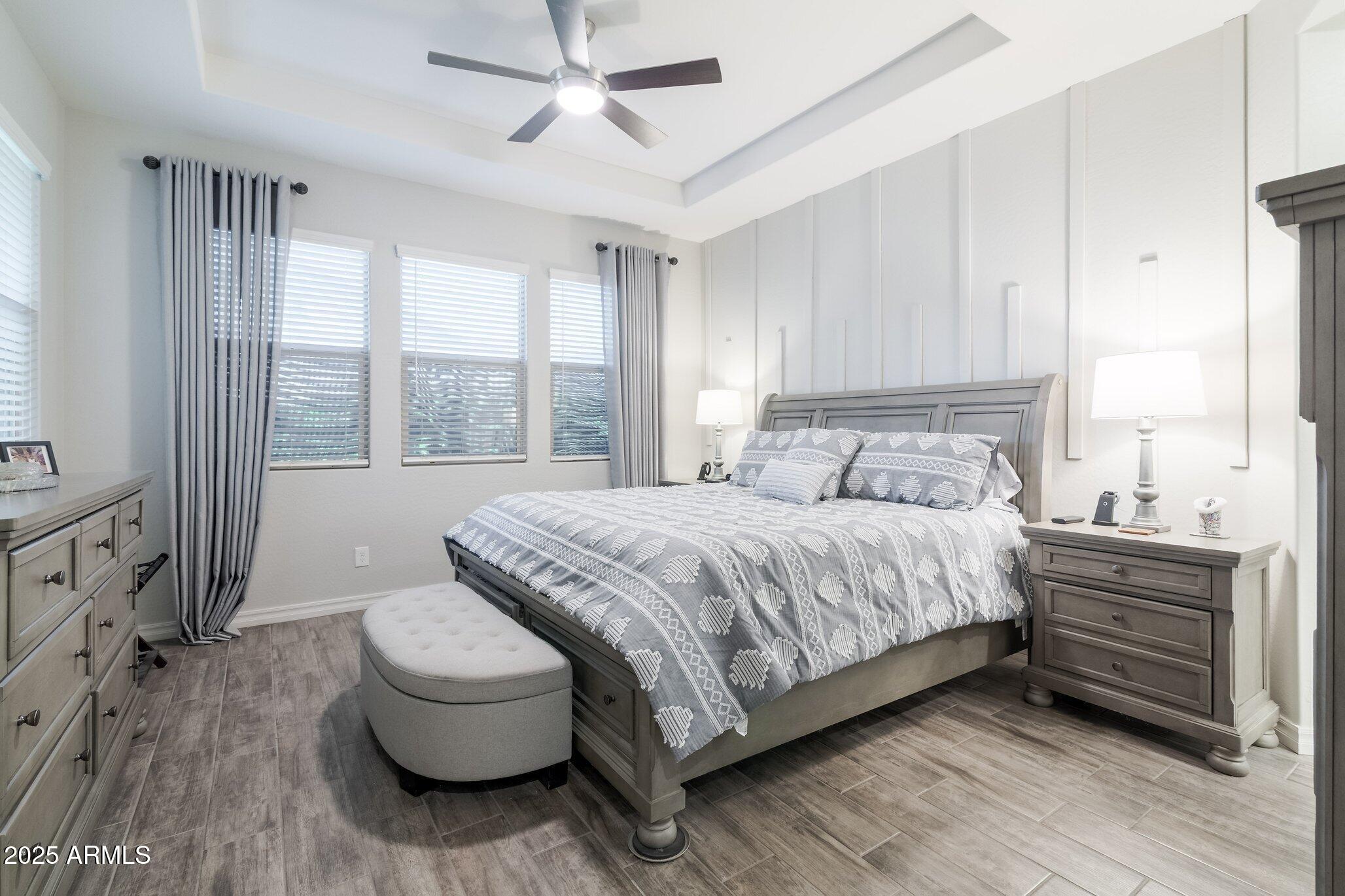 3437 East Appaloosa Road Gilbert, AZ 85296 - Photo 17 of 47 a bedroom with a bed and a large window