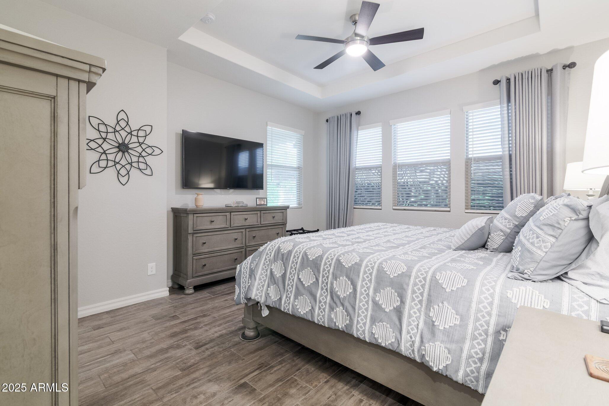 3437 East Appaloosa Road Gilbert, AZ 85296 - Photo 18 of 47 a bedroom with a bed television and a window