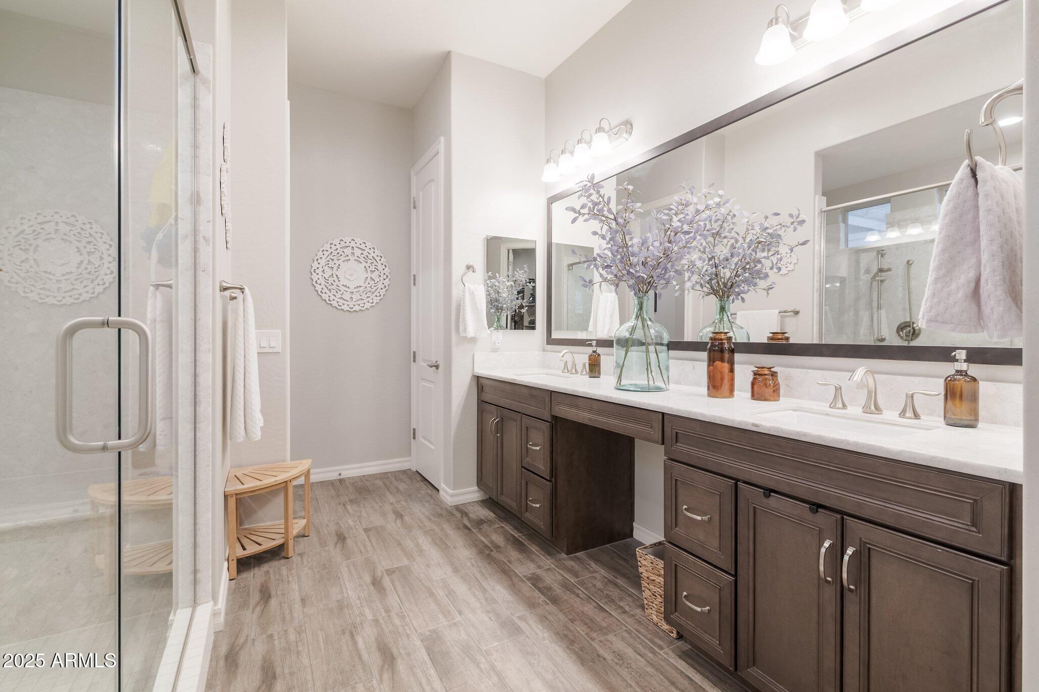 3437 East Appaloosa Road Gilbert, AZ 85296 - Photo 19 of 47 a spacious bathroom with a double vanity sink a mirror and a shower