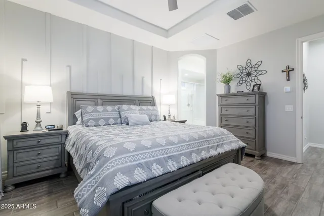 a bedroom with a bed and a dresser