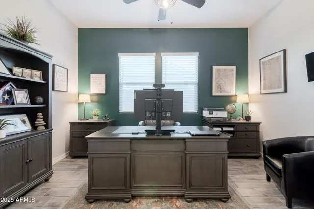 a kitchen with kitchen island granite countertop a sink cabinets and window