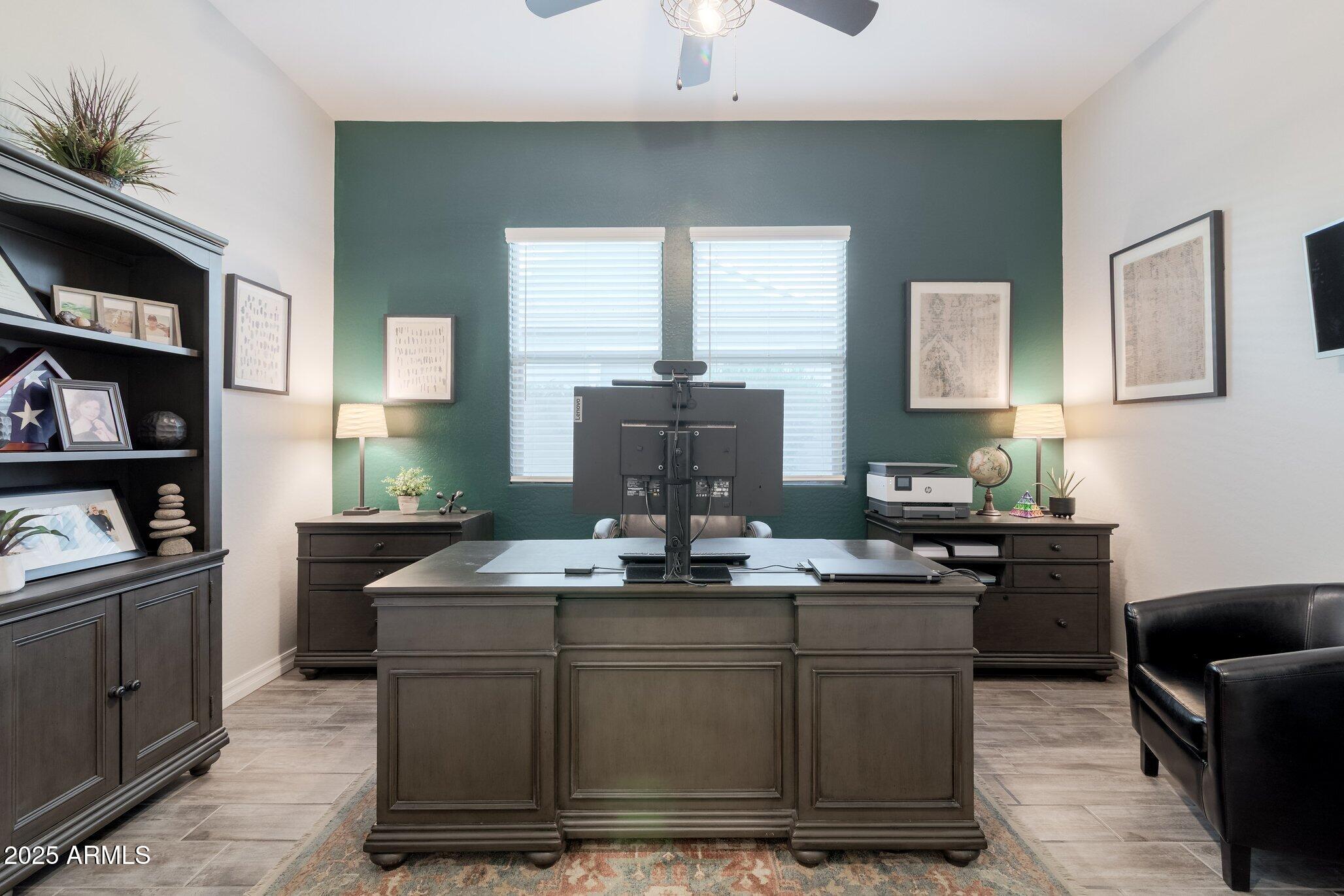 3437 East Appaloosa Road Gilbert, AZ 85296 - Photo 23 of 47 a kitchen with kitchen island granite countertop a sink cabinets and window