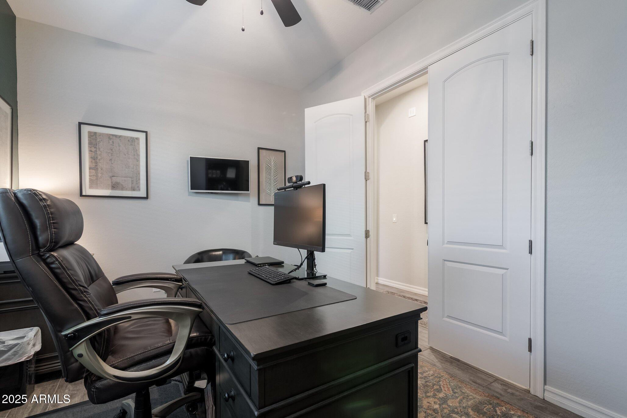 3437 East Appaloosa Road Gilbert, AZ 85296 - Photo 25 of 47 a workspace with furniture and lamp