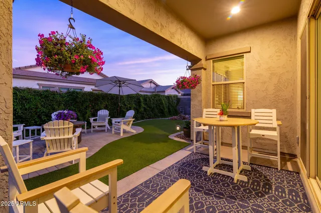 a view of a backyard with sitting area