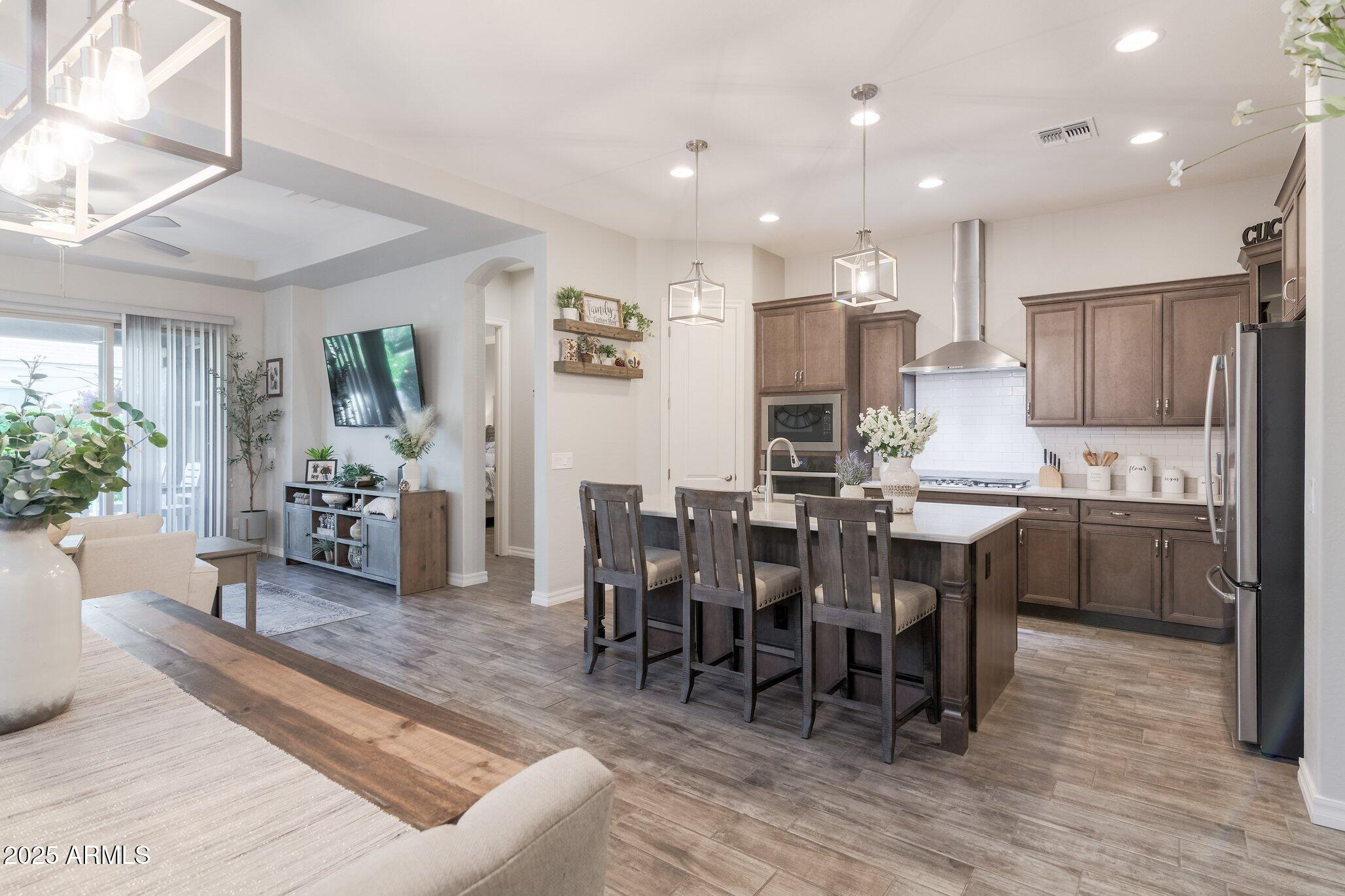 3437 East Appaloosa Road Gilbert, AZ 85296 - Photo 5 of 47 a large kitchen with cabinets table and chairs