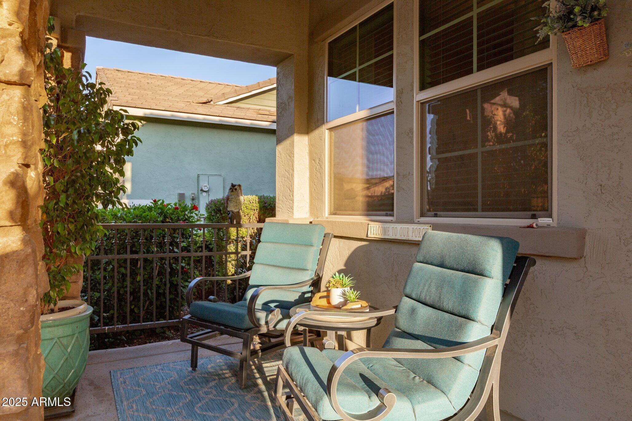 3437 East Appaloosa Road Gilbert, AZ 85296 - Photo 7 of 47 a view of a chair and tables in the back yard of the house