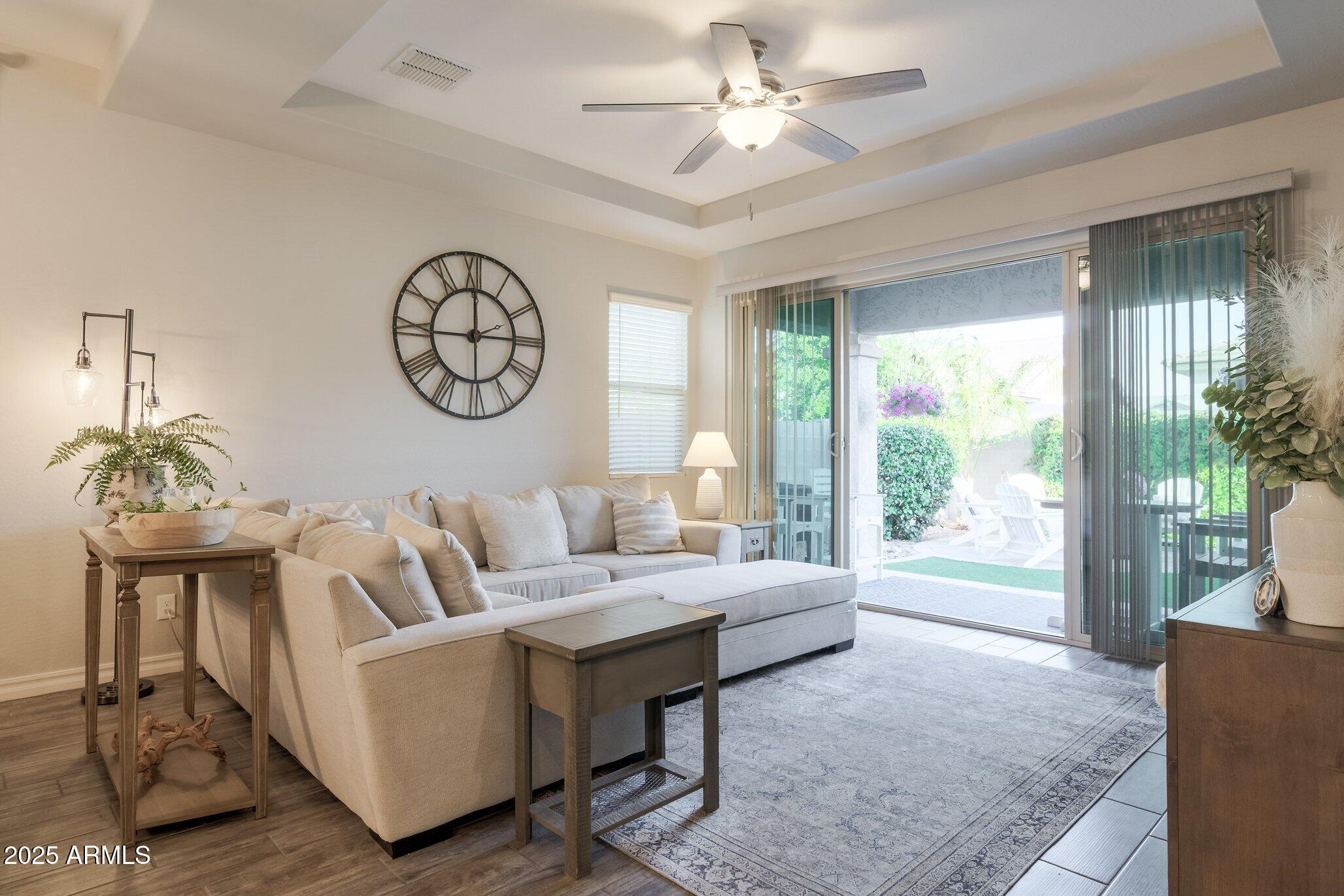 3437 East Appaloosa Road Gilbert, AZ 85296 - Photo 9 of 47 a living room with furniture a table and a large window