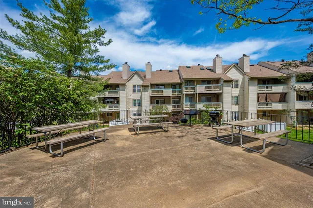 a view of a building with sitting area