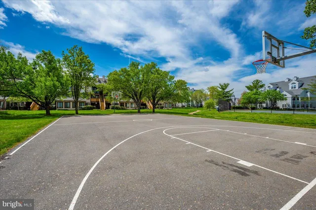 a view of a playground with basketball court