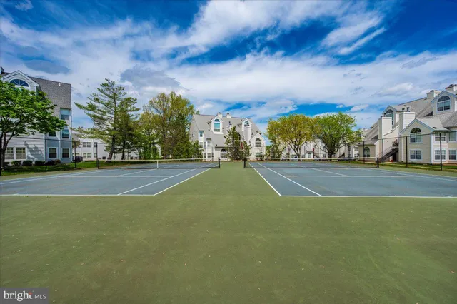 a view of an outdoor space and tennis court