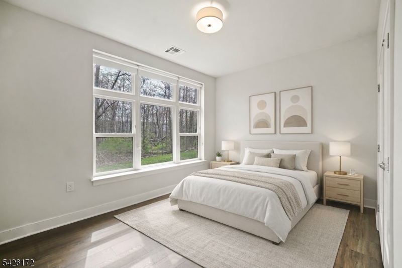434 Springfield Avenue, Unit 146 Berkeley Heights, NJ 07922 - Photo 12 of 32 a bedroom with a bed and a large window