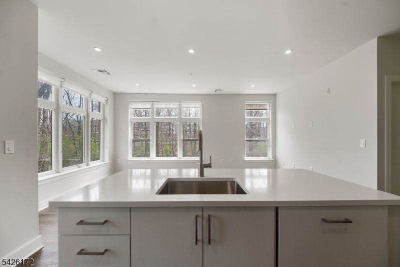 434 Springfield Avenue, Unit 146 Berkeley Heights, NJ 07922 - Photo 23 of 32 a kitchen with a sink and windows