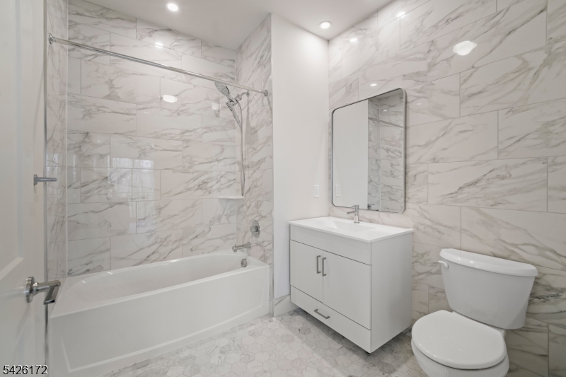 434 Springfield Avenue, Unit 146 Berkeley Heights, NJ 07922 - Photo 31 of 32 a bathroom with a sink a toilet and shower