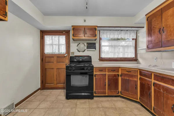 a kitchen with stainless steel appliances a stove and a sink