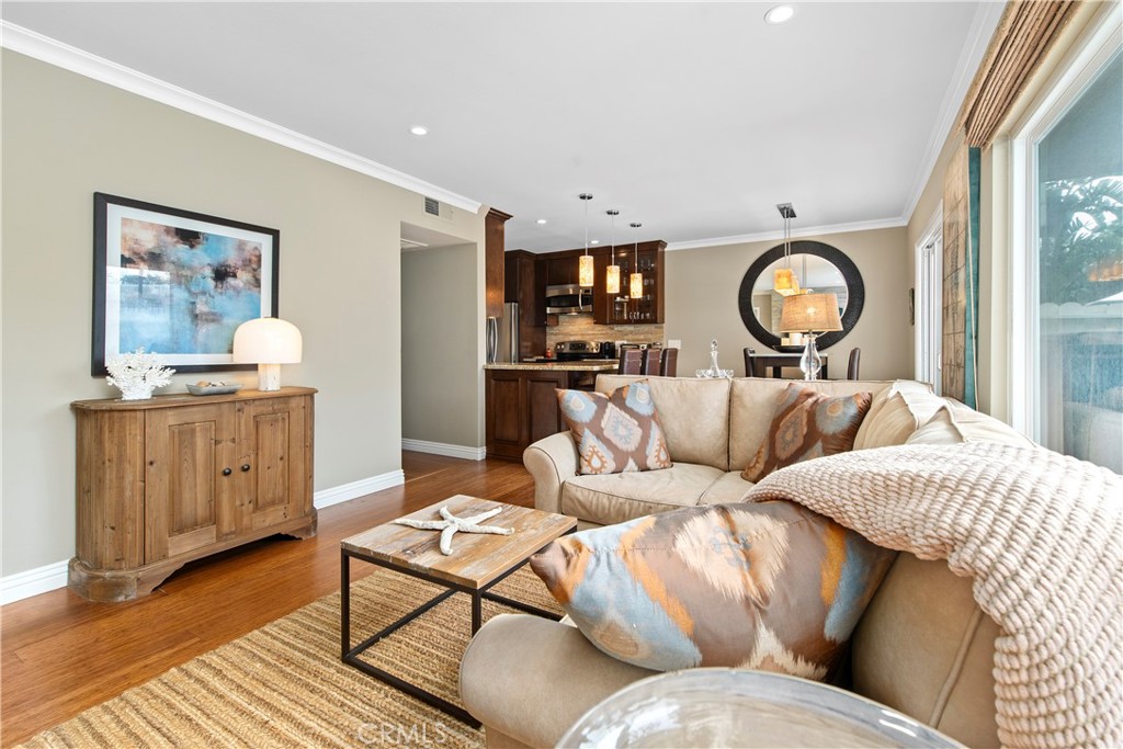 33623 Avenida Capri, Unit 60 Dana Point, CA 92629 - Photo 12 of 38 a living room with furniture and a mirror