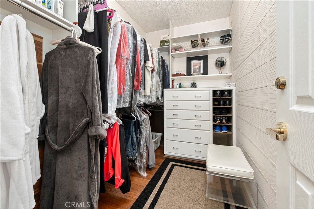33623 Avenida Capri, Unit 60 Dana Point, CA 92629 - Photo 17 of 38 a view of walk in closet with clothes and shoes