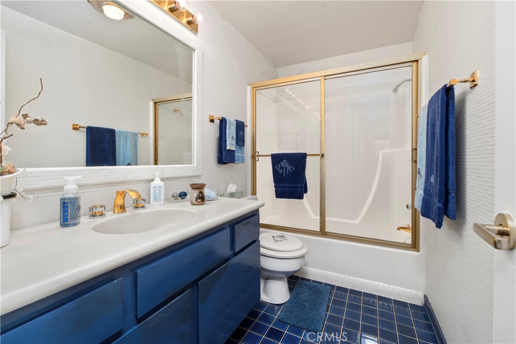 33623 Avenida Capri, Unit 60 Dana Point, CA 92629 - Photo 19 of 38 a bathroom with a sink toilet a mirror and shower