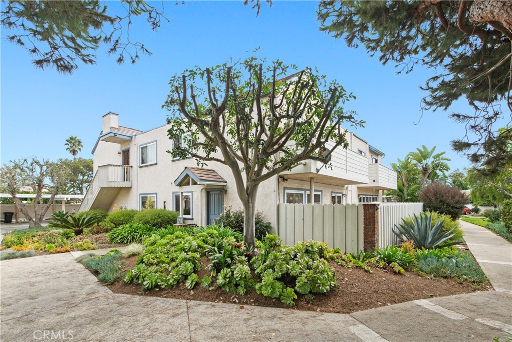 33623 Avenida Capri, Unit 60 Dana Point, CA 92629 - Photo 2 of 38 a front view of a house with a garden