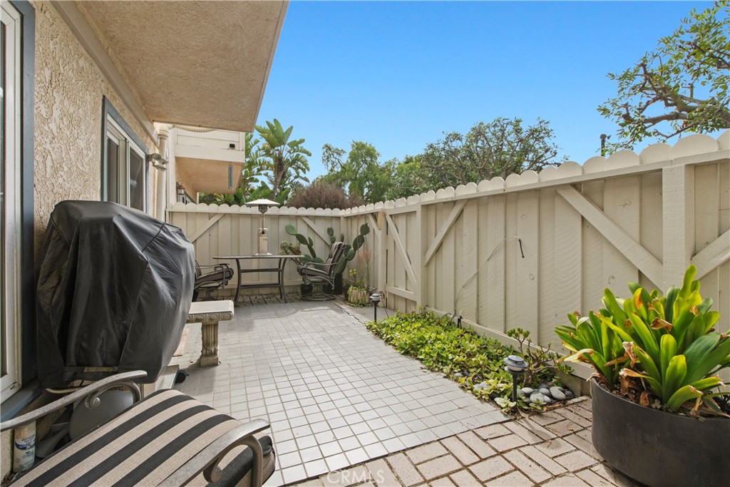 33623 Avenida Capri, Unit 60 Dana Point, CA 92629 - Photo 21 of 38 a view of backyard with tub and potted plants