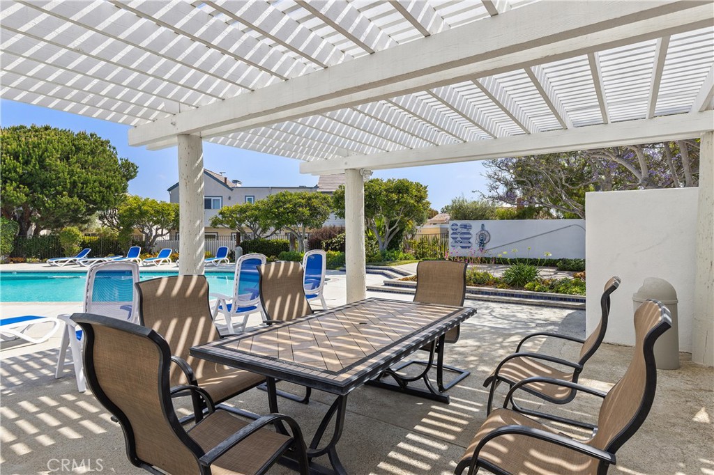 33623 Avenida Capri, Unit 60 Dana Point, CA 92629 - Photo 25 of 38 a view of a patio with couple of chairs and a table