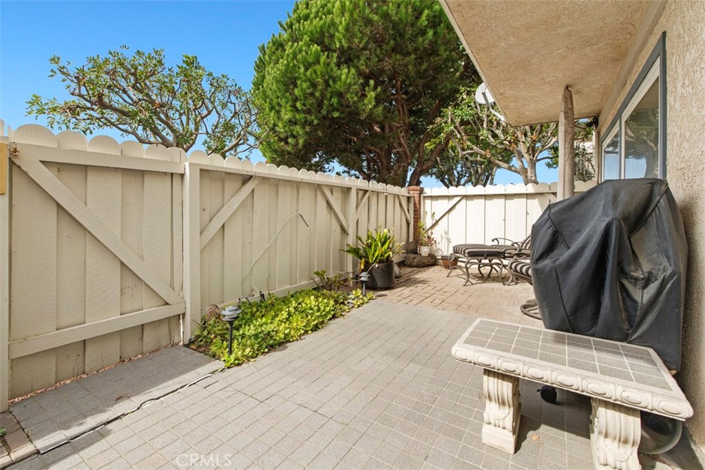 33623 Avenida Capri, Unit 60 Dana Point, CA 92629 - Photo 26 of 38 a view of balcony with wooden floor and outdoor seating