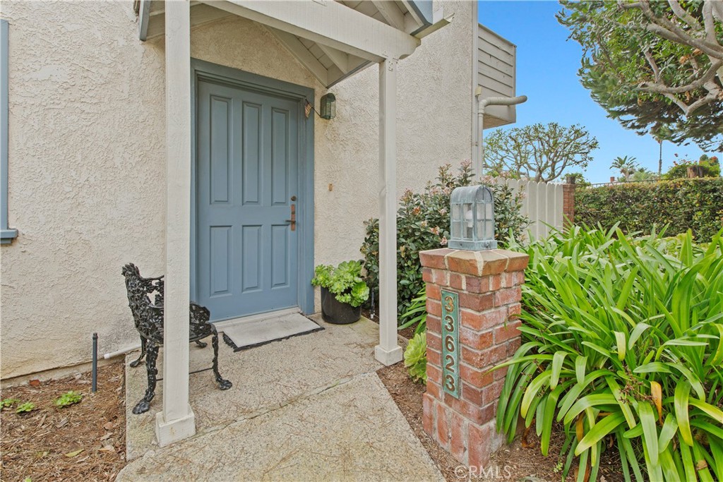 33623 Avenida Capri, Unit 60 Dana Point, CA 92629 - Photo 27 of 38 a backyard of a house with outdoor seating