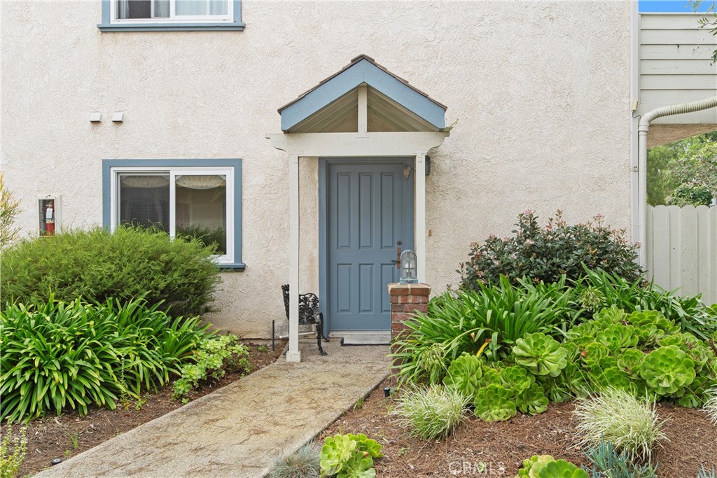 33623 Avenida Capri, Unit 60 Dana Point, CA 92629 - Photo 31 of 38 a front view of a house with garden
