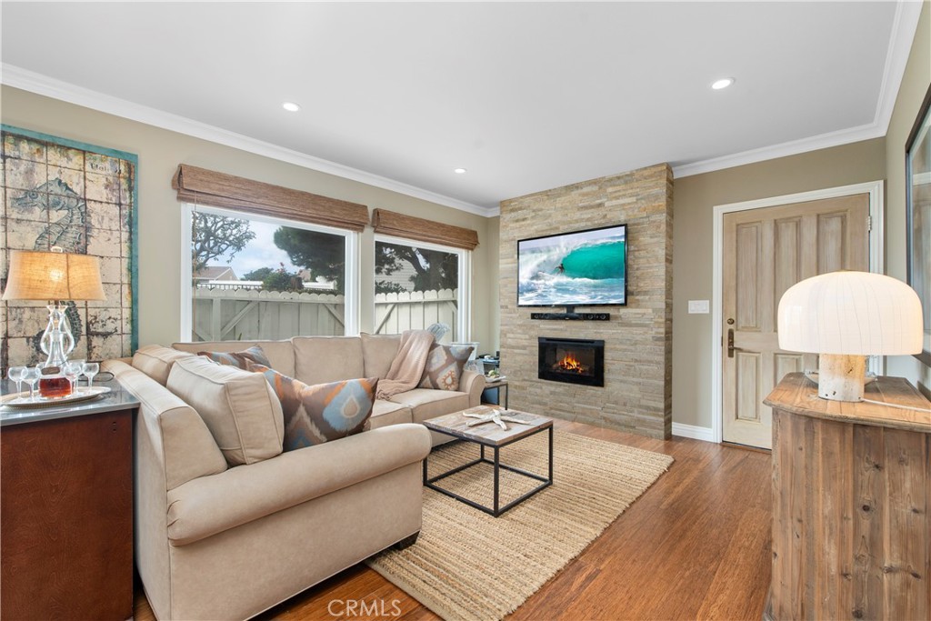 33623 Avenida Capri, Unit 60 Dana Point, CA 92629 - Photo 4 of 38 a living room with furniture and a fireplace