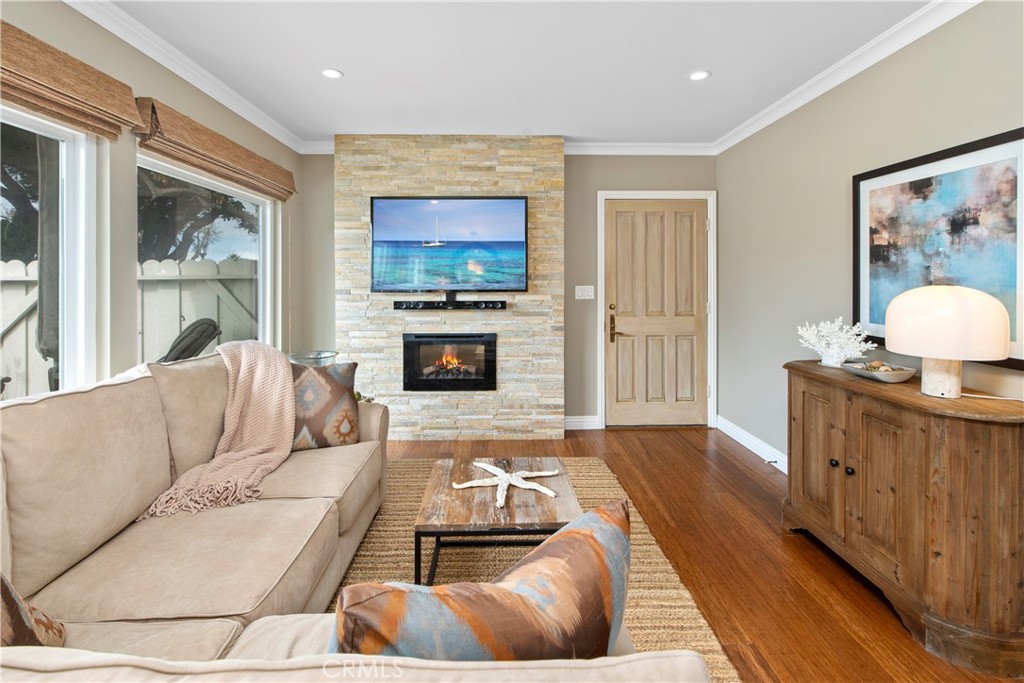 33623 Avenida Capri, Unit 60 Dana Point, CA 92629 - Photo 5 of 38 a living room with furniture and a flat screen tv