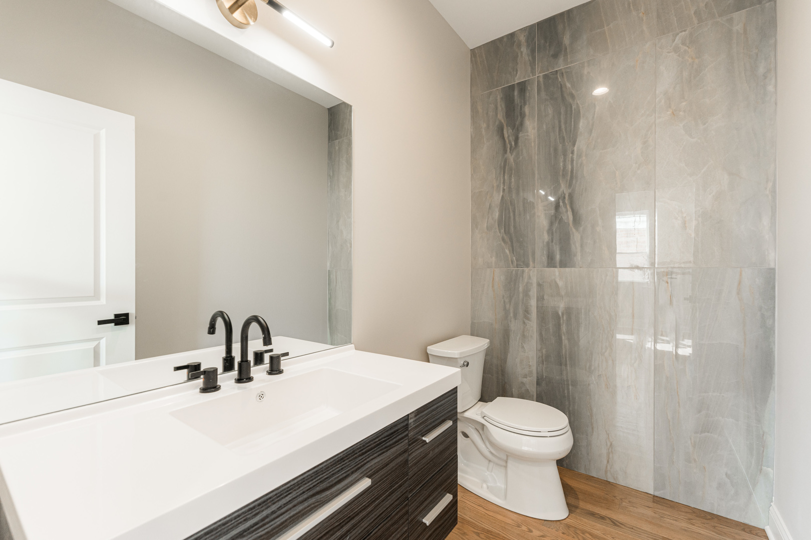 8121 W Forest Chicago, IL 60634 - Photo 13 of 44 a bathroom with a sink a toilet and shower