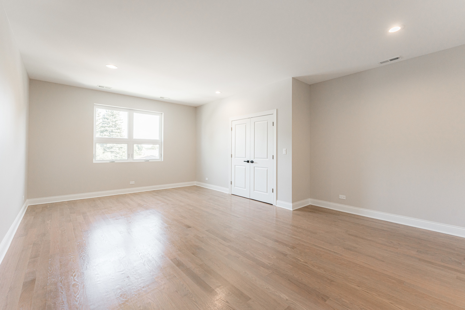 8121 W Forest Chicago, IL 60634 - Photo 17 of 44 an empty room with wooden floor and window