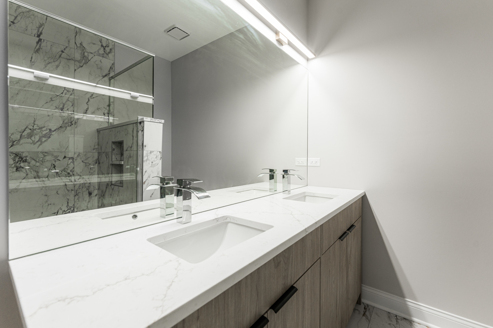 8121 W Forest Chicago, IL 60634 - Photo 20 of 44 a bathroom with a sink and a mirror