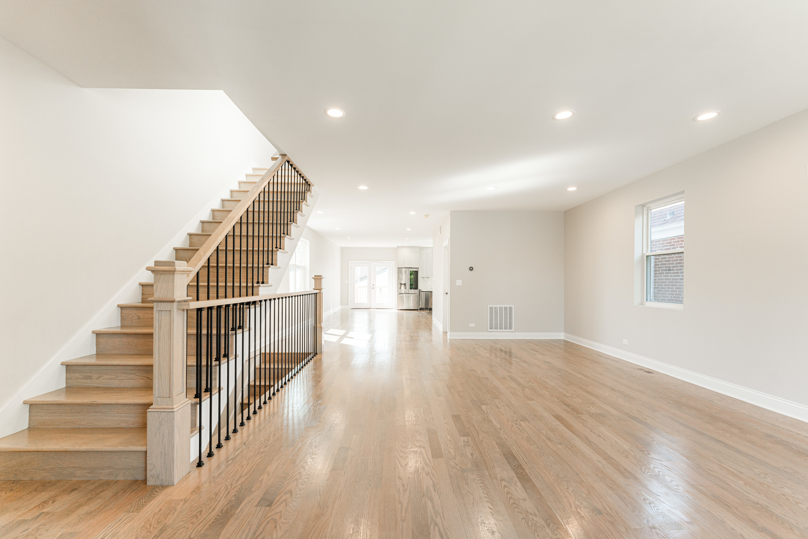 8121 W Forest Chicago, IL 60634 - Photo 2 of 44 a view of a hallway with wooden floor and staircase