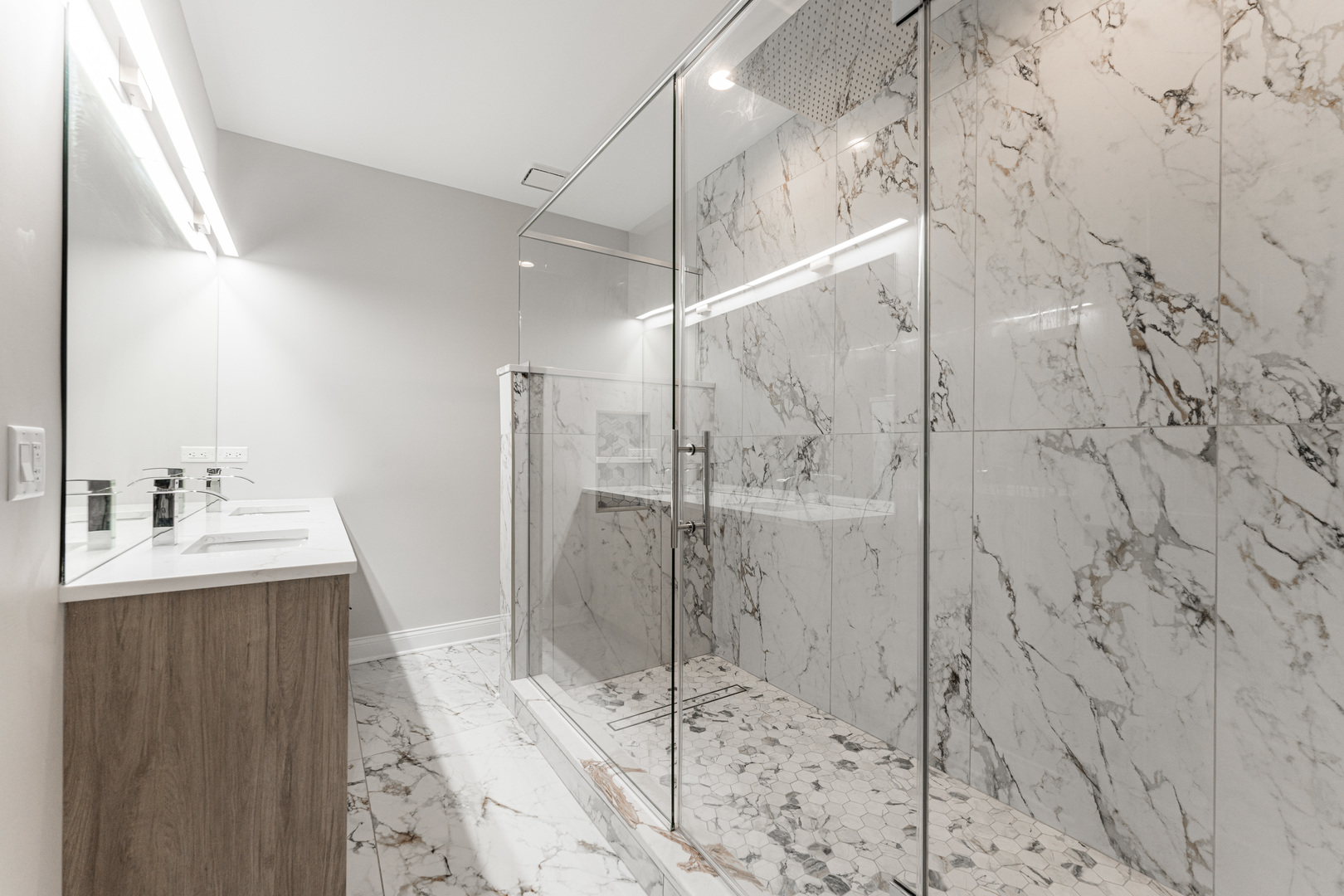 8121 W Forest Chicago, IL 60634 - Photo 21 of 44 a bathroom with a shower and a sink