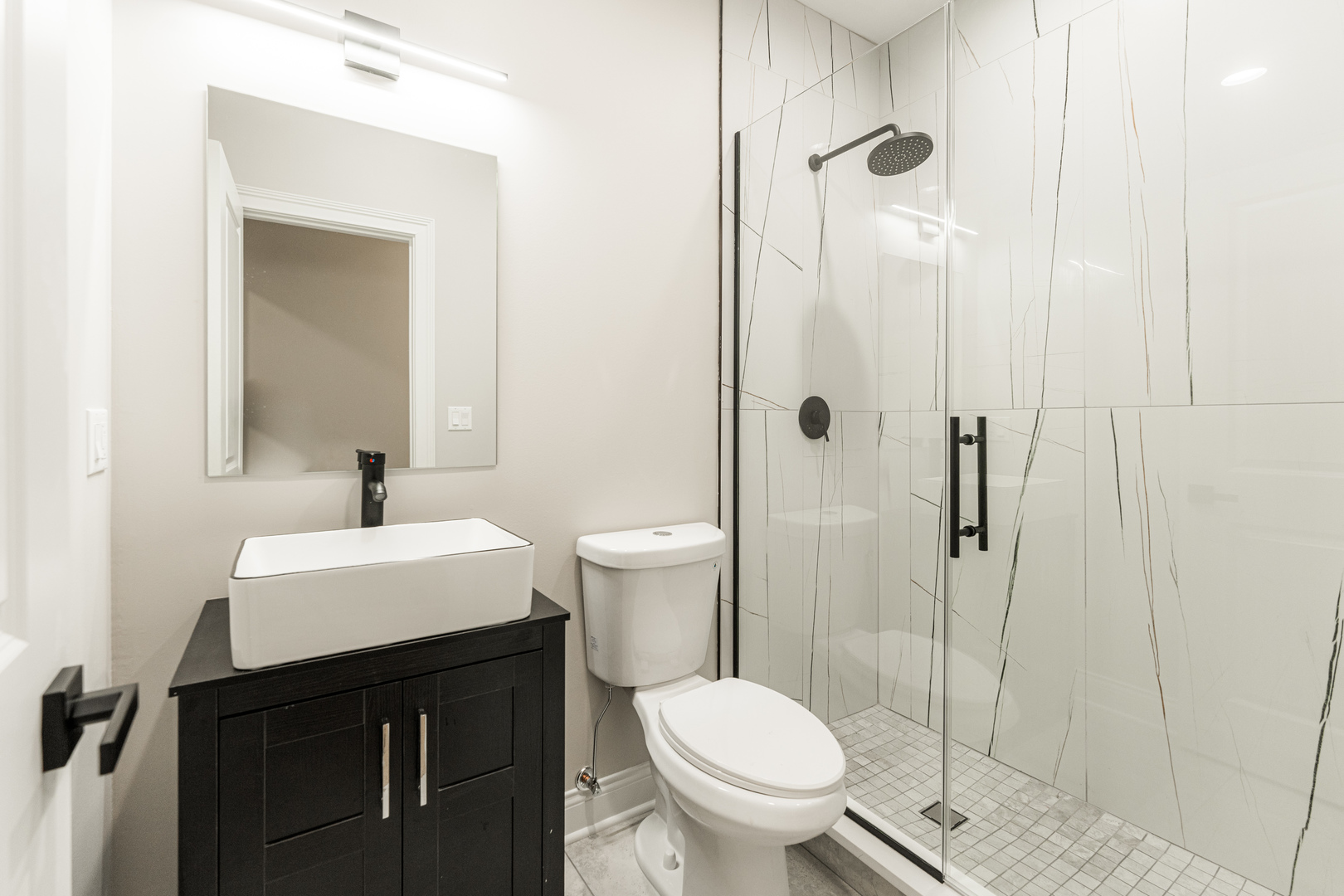 8121 W Forest Chicago, IL 60634 - Photo 36 of 44 a bathroom with a sink a toilet and shower