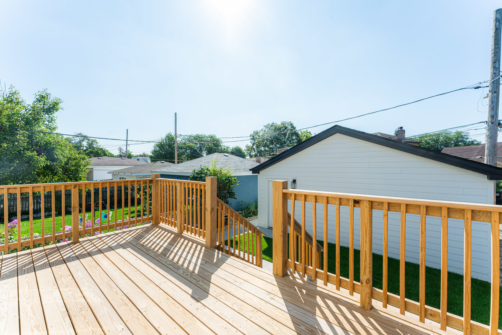 8121 W Forest Chicago, IL 60634 - Photo 39 of 44 a view of balcony with wooden floor and fence
