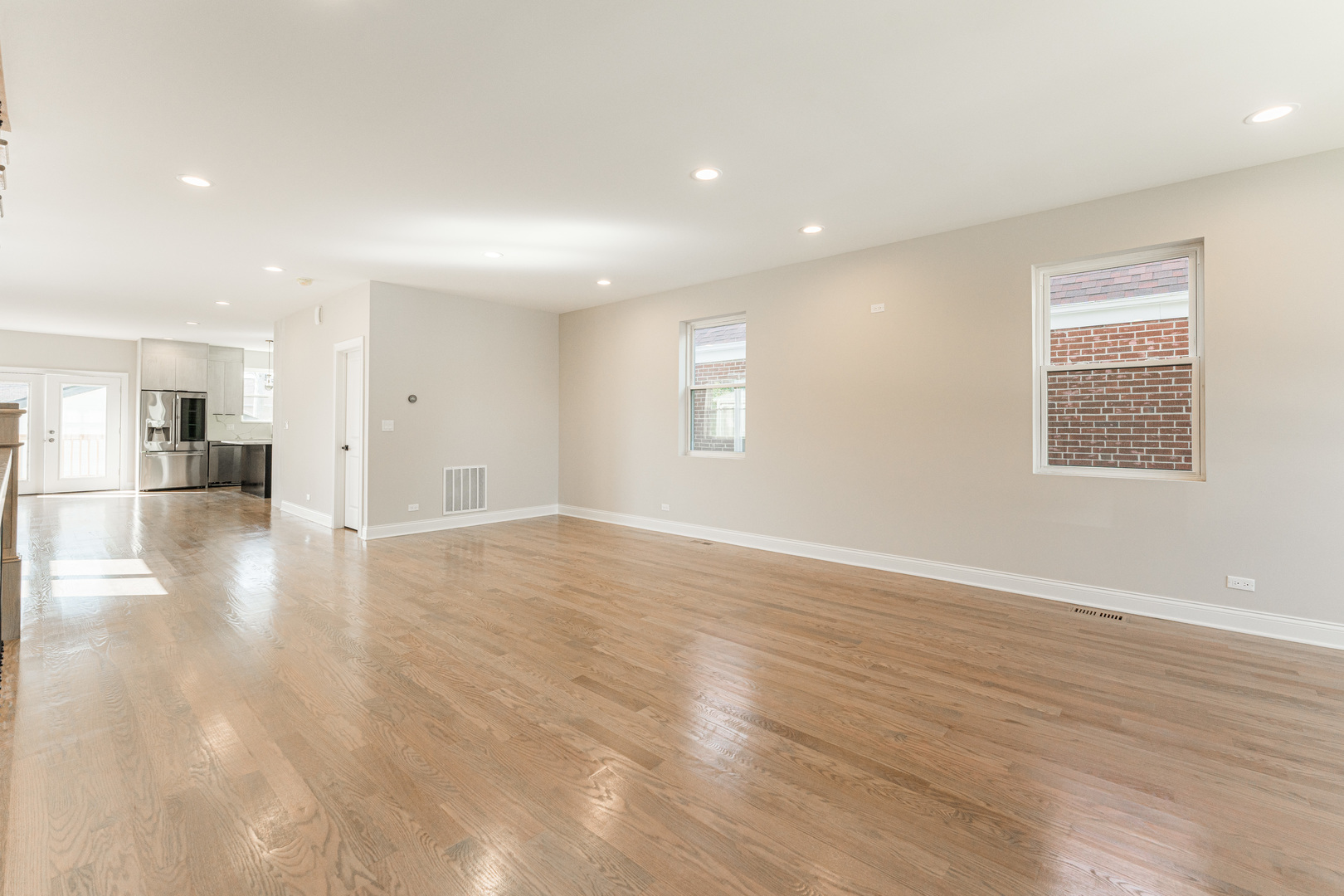 8121 W Forest Chicago, IL 60634 - Photo 4 of 44 a view of empty room with wooden floor and windows