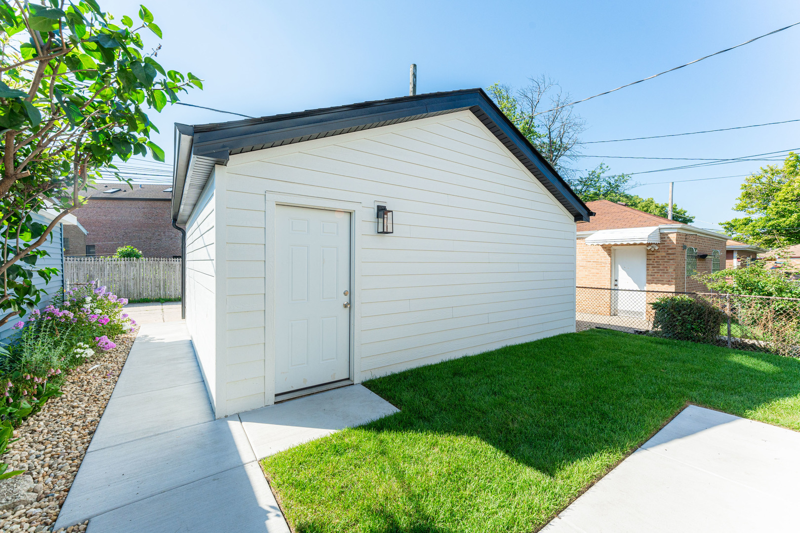 8121 W Forest Chicago, IL 60634 - Photo 42 of 44 a view of backyard with potted plants and a tree