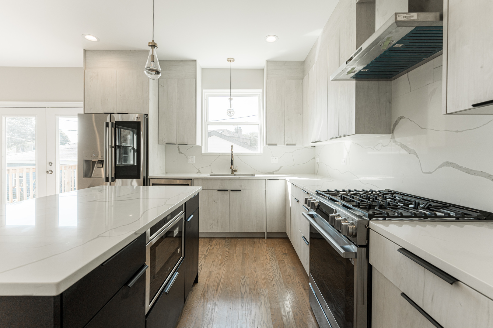 8121 W Forest Chicago, IL 60634 - Photo 10 of 44 a kitchen with granite countertop a sink stove and cabinets