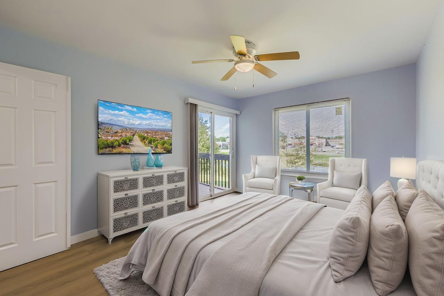 7526 Bristol Lane, Unit 2 Hanover Park, IL 60133 - Photo 11 of 21 a bedroom with a bed and a chandelier