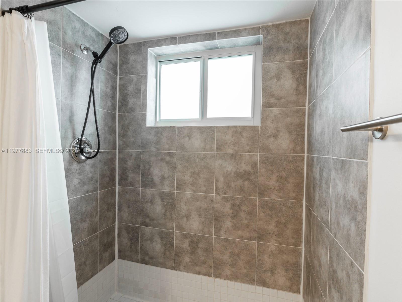 8329 Southwest 137th Avenue, Unit 8329 Miami, FL 33183 - Photo 18 of 33 a bathroom with a shower